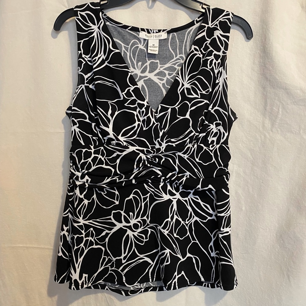 White floral print on blk stretch blend.